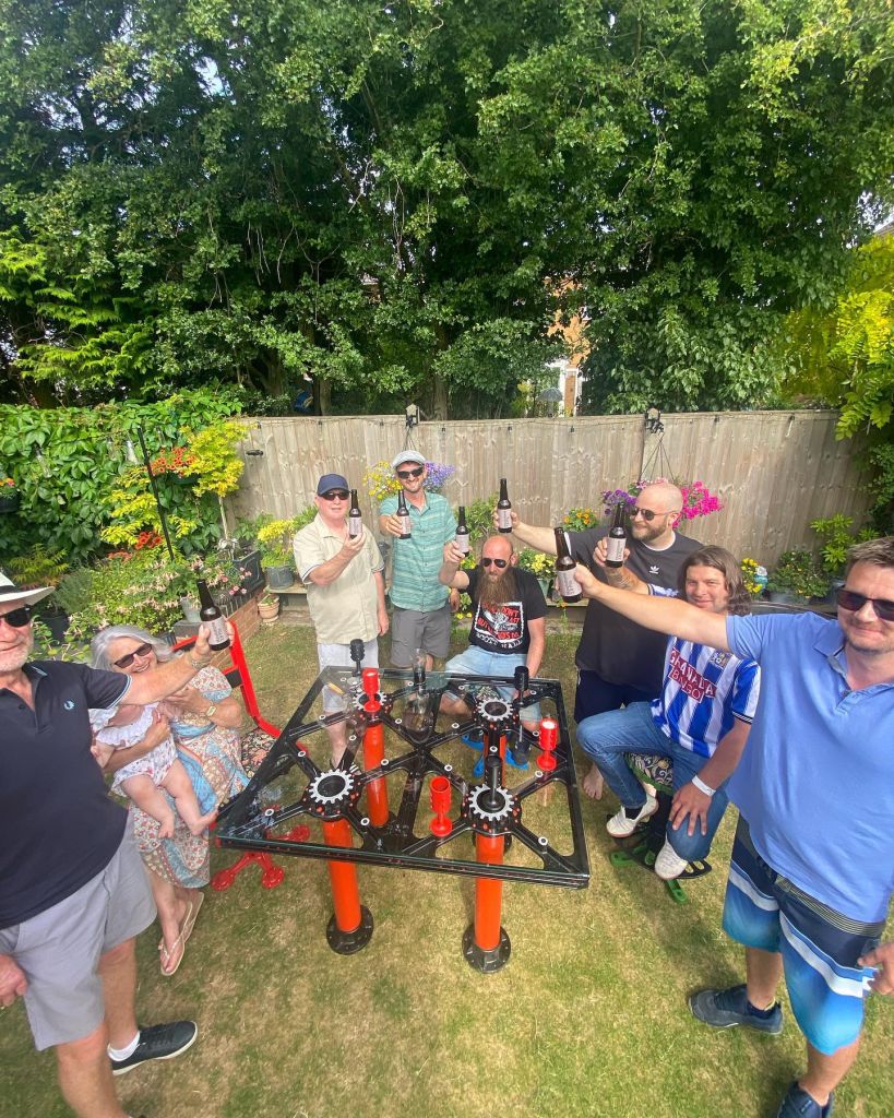 people having a garden party with steampunk furniture
