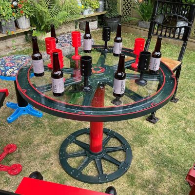 steampunk table in garden with chairs